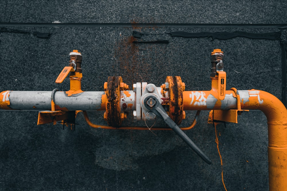 orange and black metal pipe