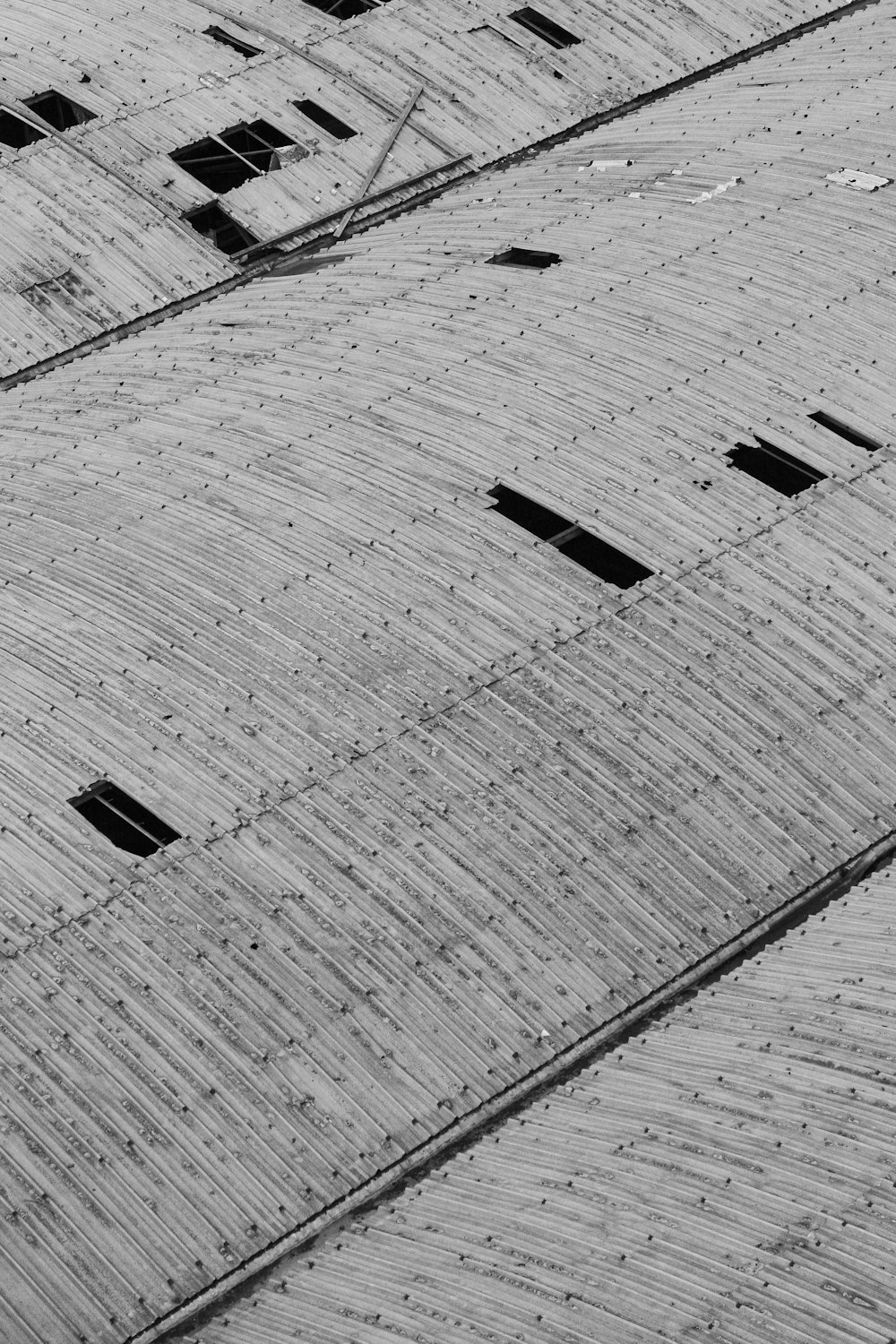 grayscale photo of concrete brick floor