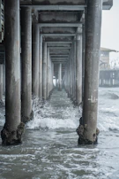 Close-up of one of the six pillars cracking and dissolving into the sea.