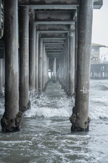 Close-up of one of the six pillars cracking and dissolving into the sea.