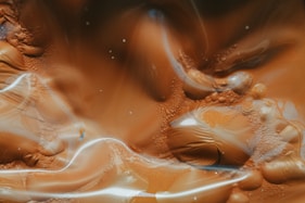water drops on brown surface