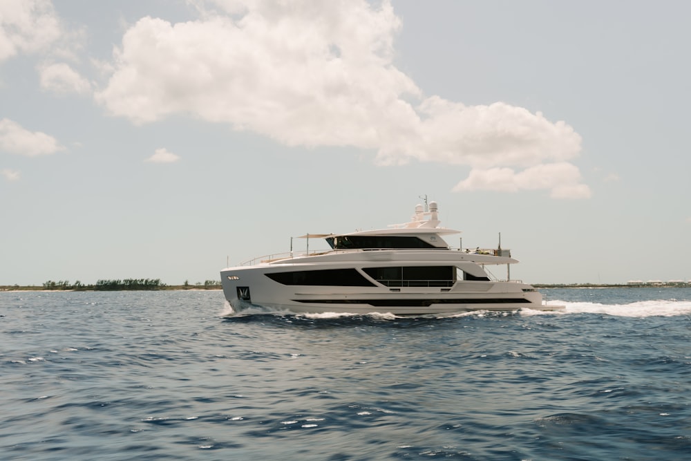 white boat on body of water during daytime