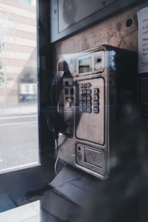 black and silver telephone booth
