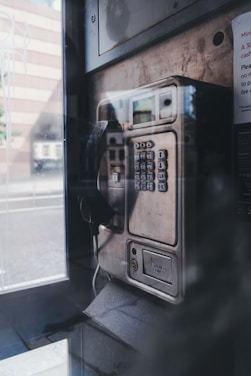 black and silver telephone booth