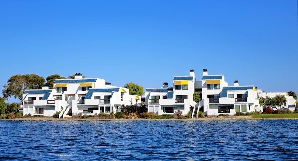 white concrete building near body of water during daytime