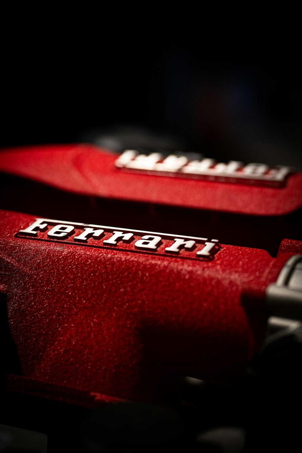 a close up of two red suitcases in the dark