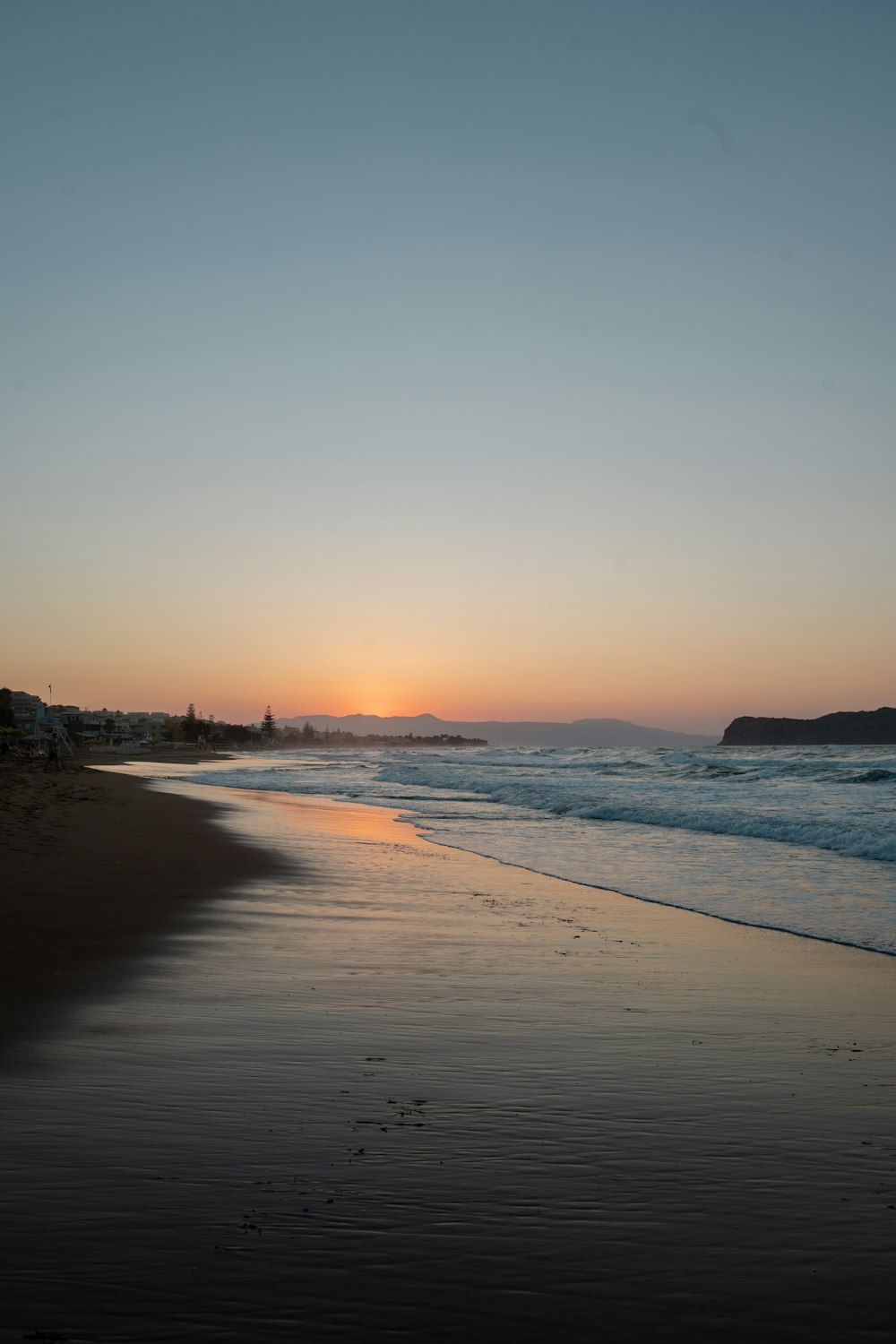 people on beach during sunset