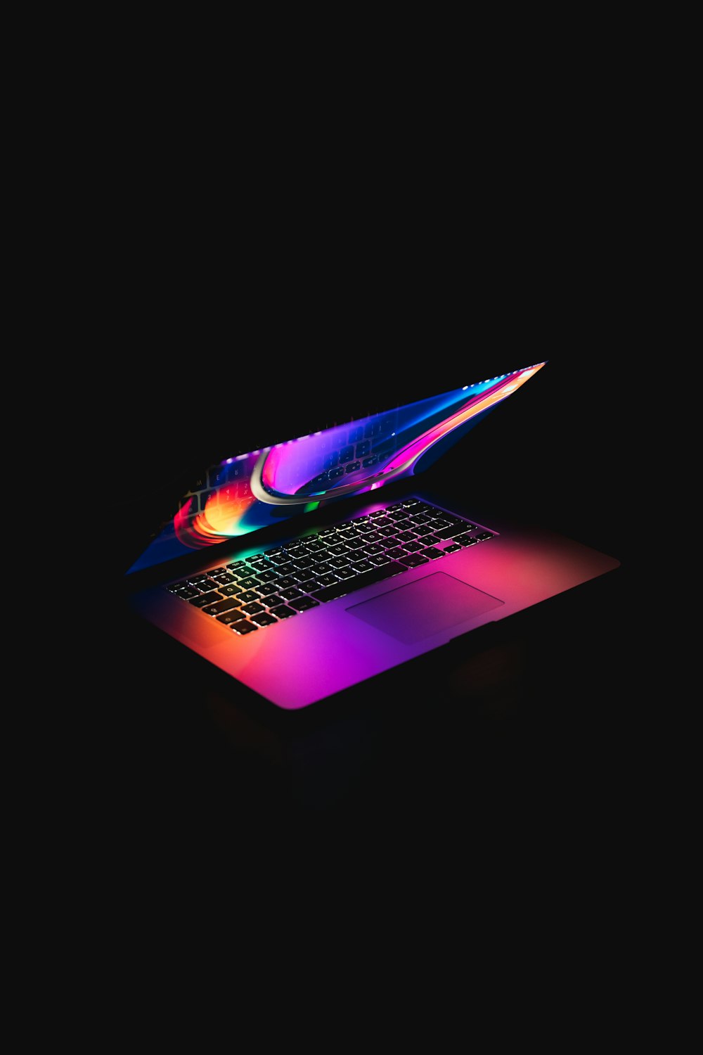 macbook pro on black background