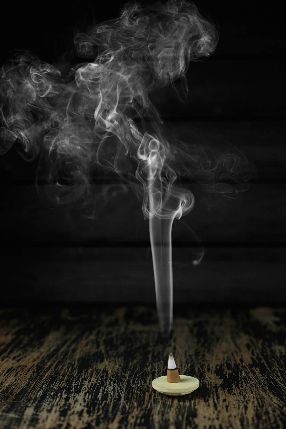 white smoke on black surface