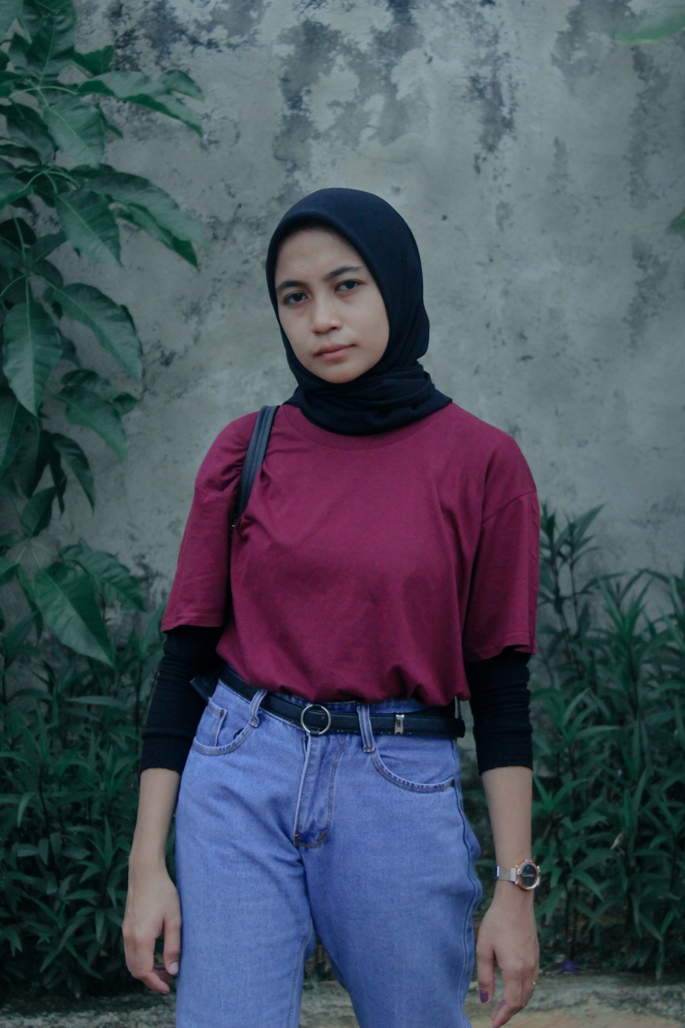 woman in red long sleeve shirt and blue denim jeans