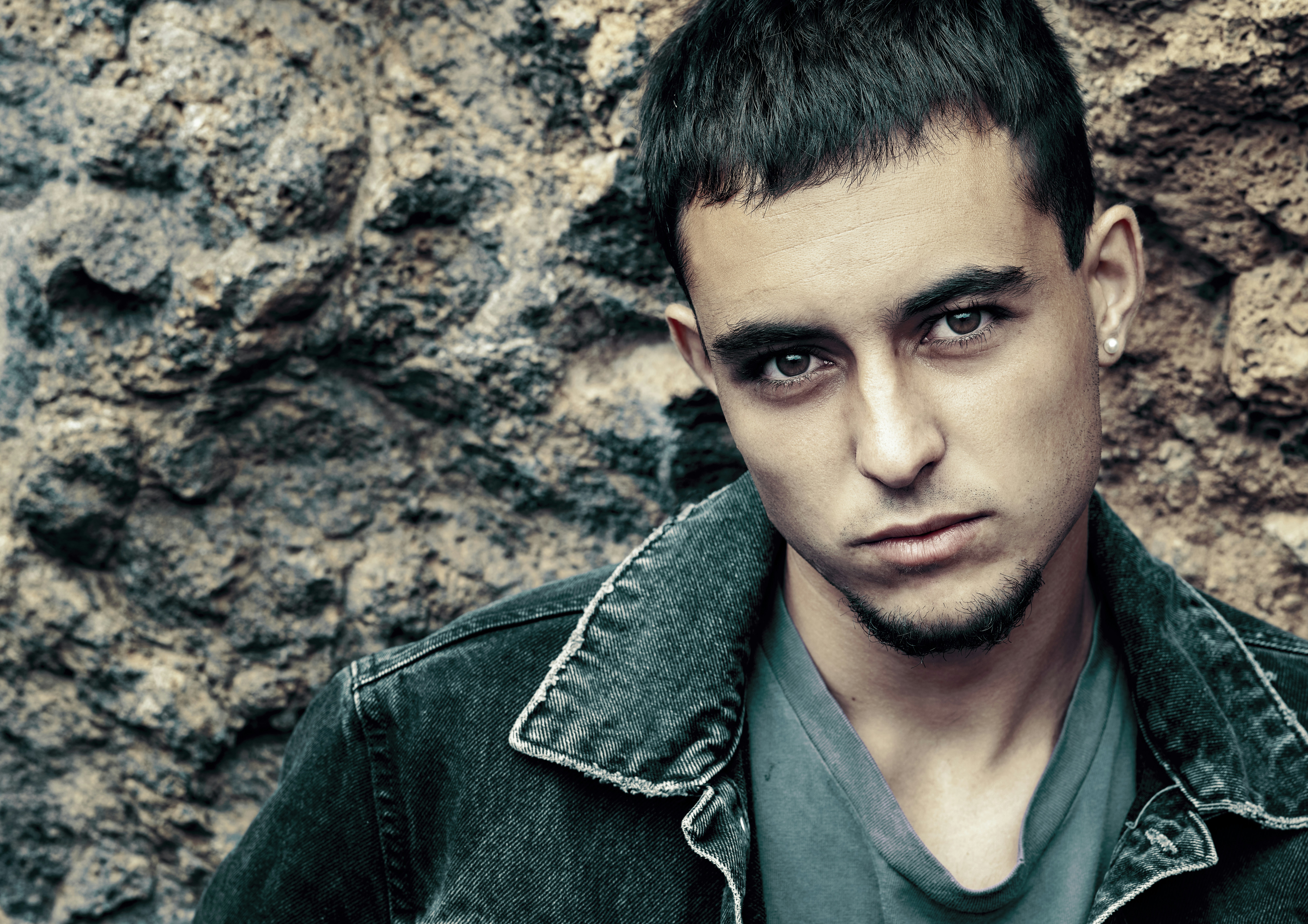 man in green button up shirt and blue denim jacket