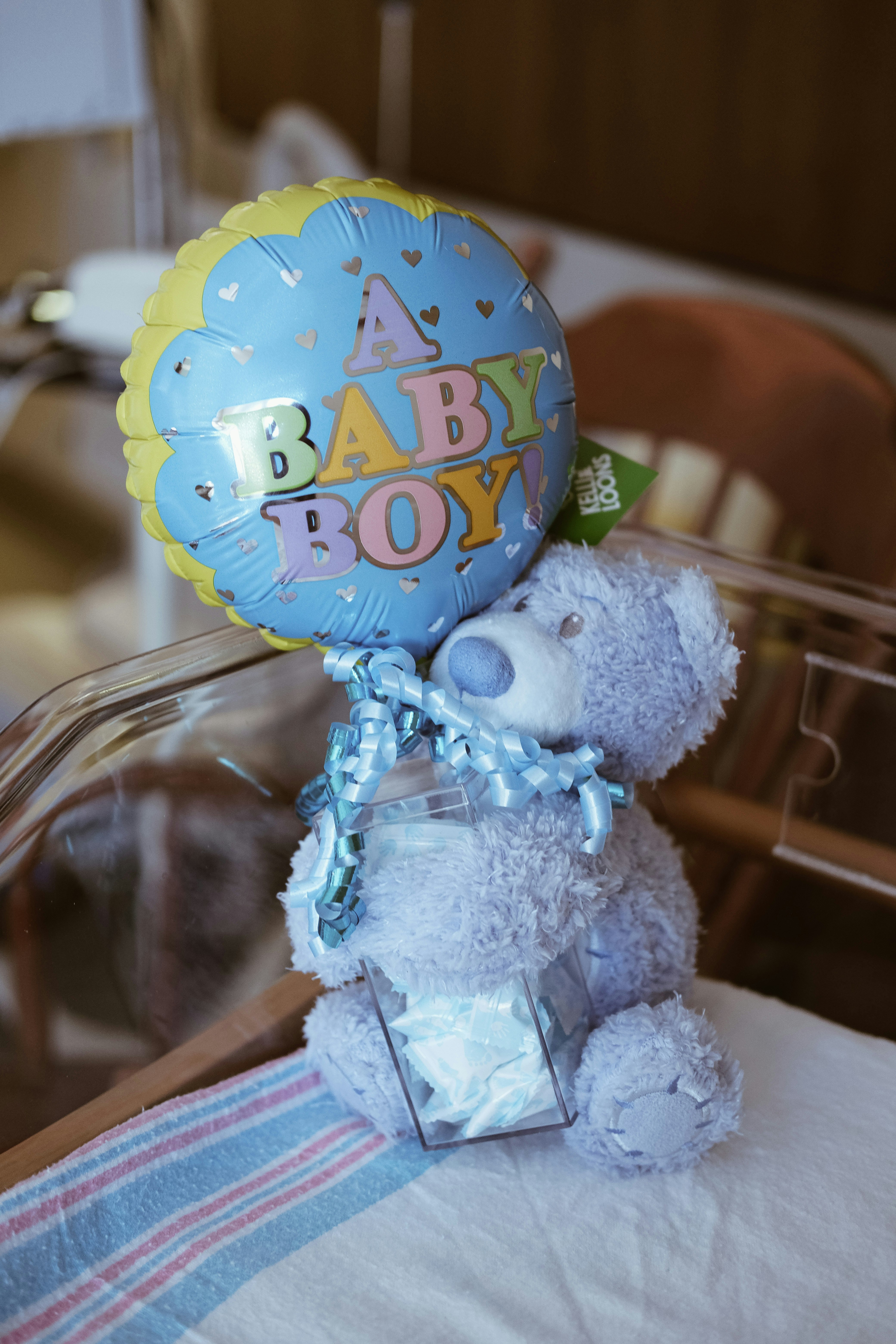 brown bear plush toy with happy birthday hat