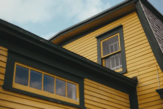 brown and black wooden house under blue sky during daytime
