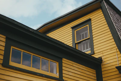 brown and black wooden house under blue sky during daytime