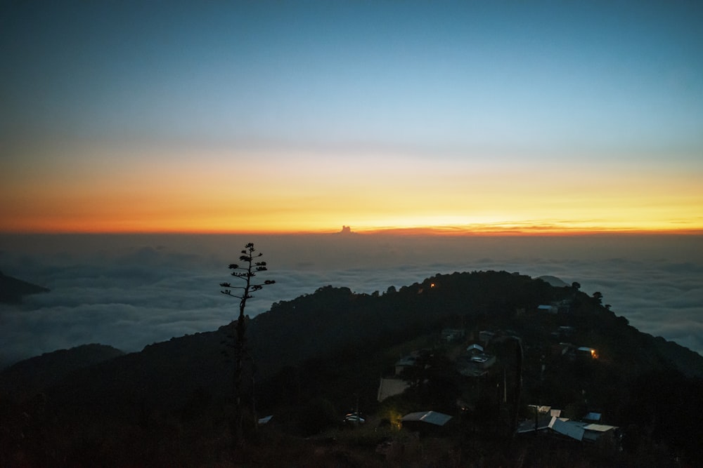 silhouette of mountain during sunset