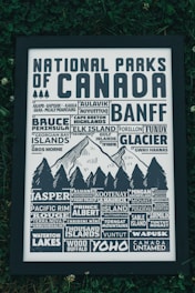 A detailed poster depicting northern Canadian landscapes with indigenous cultural motifs.