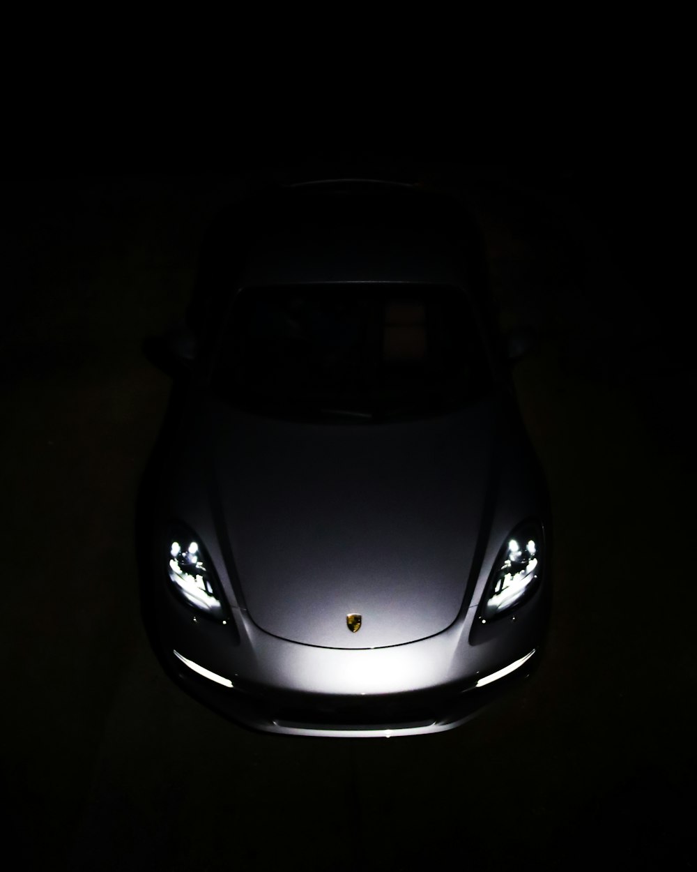 black lamborghini aventador in dark room