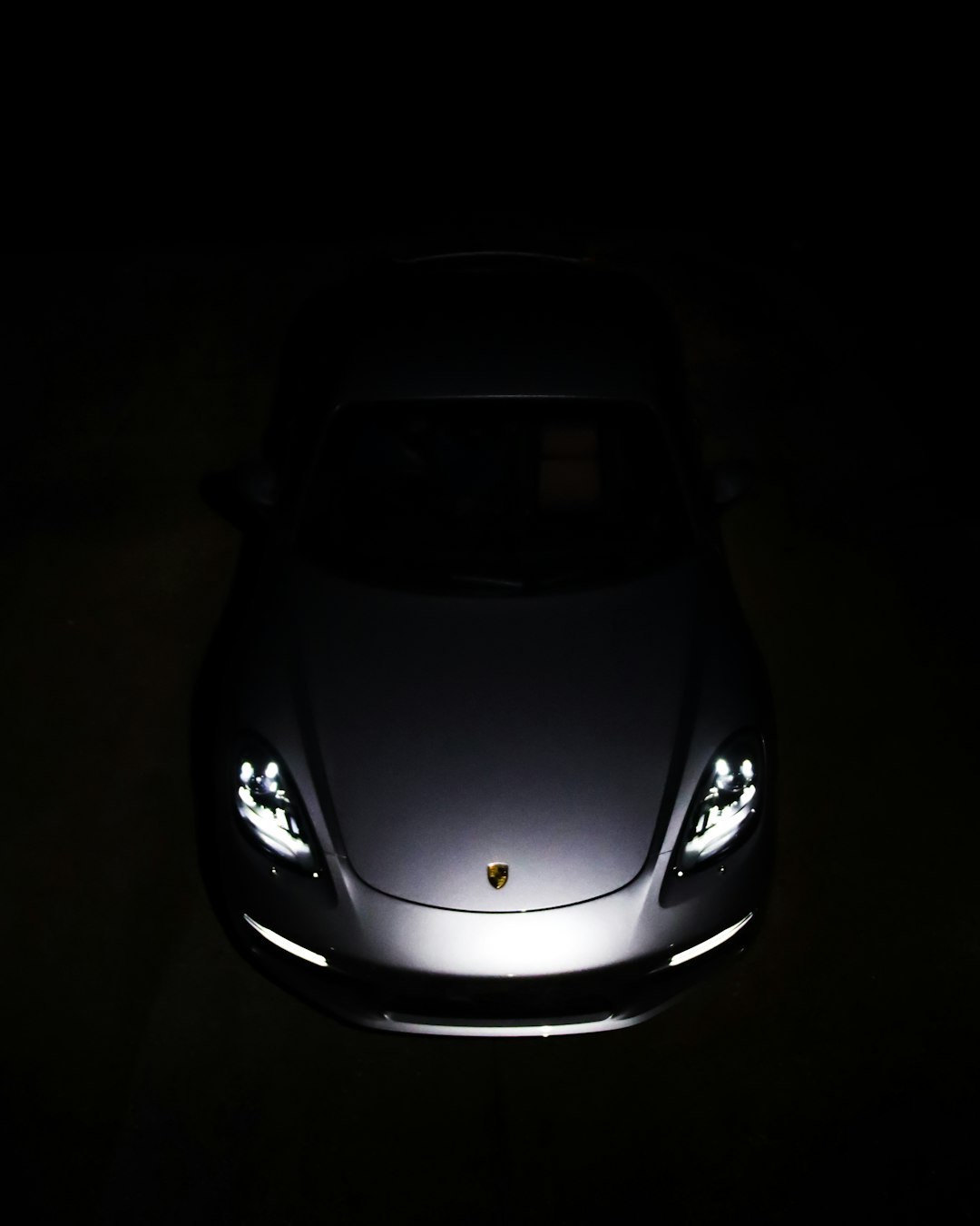 black lamborghini aventador in dark room