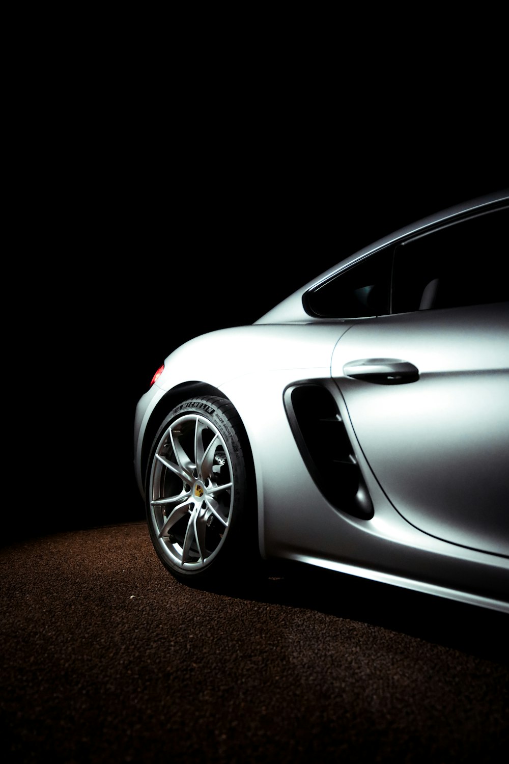 white porsche 911 on black background