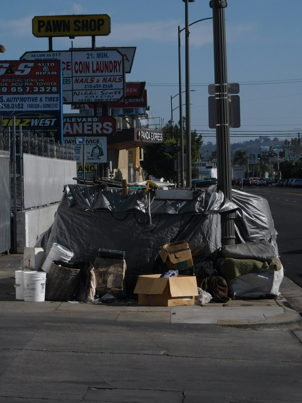 black plastic bag on gray concrete road