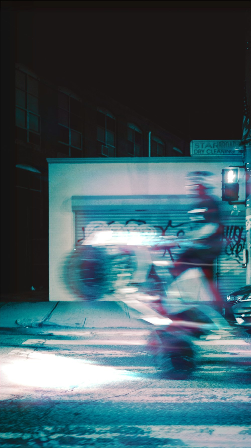 man in red jacket riding on motorcycle