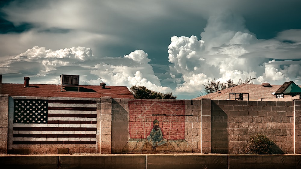 brown concrete building under white clouds during daytime