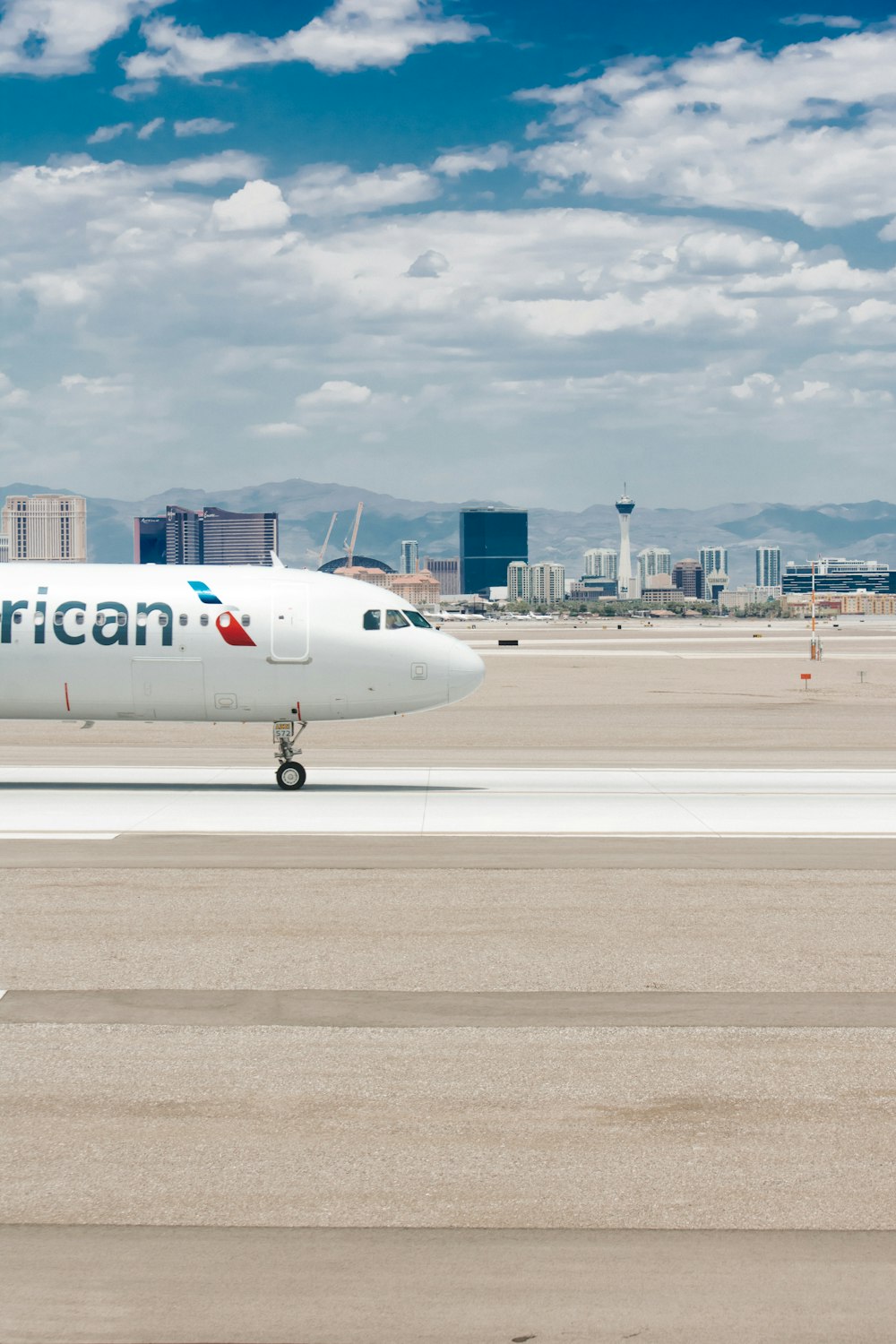 white passenger plane on airport during daytime