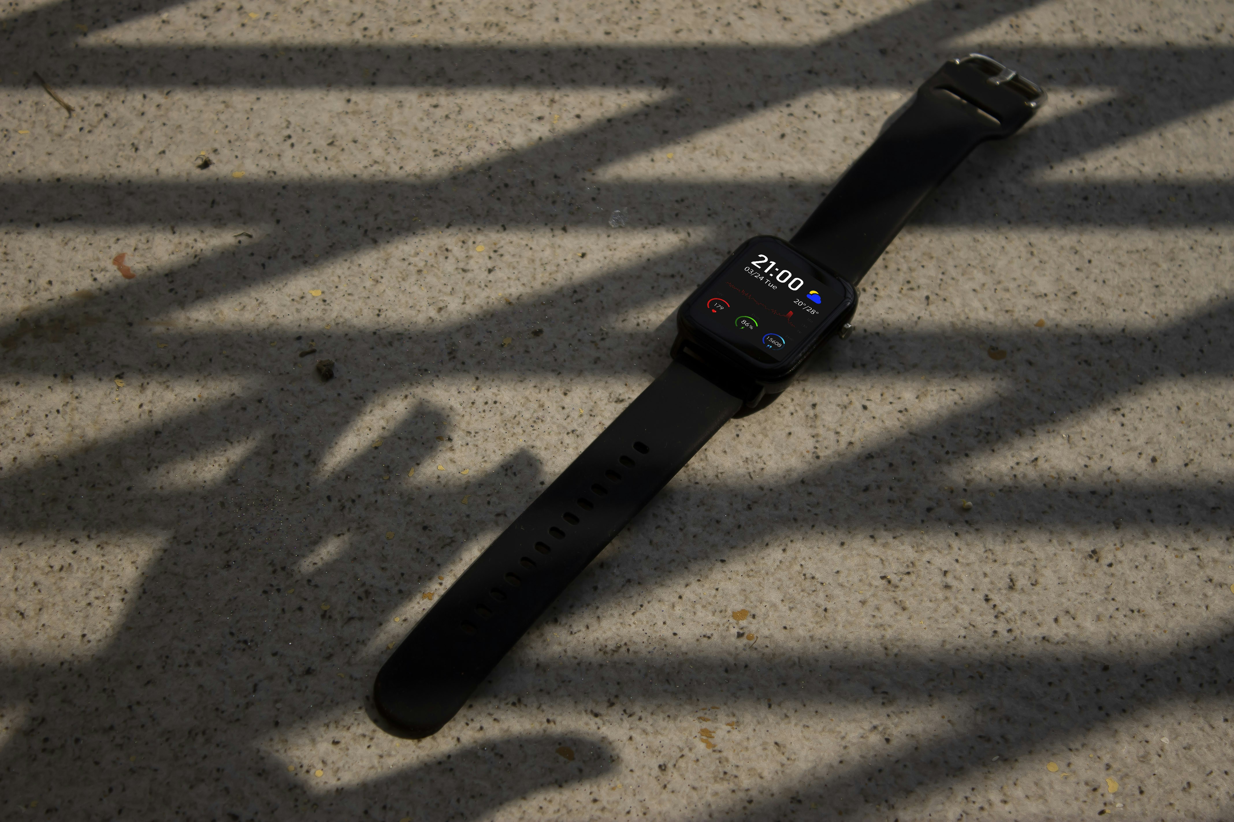 black apple watch with black sport band