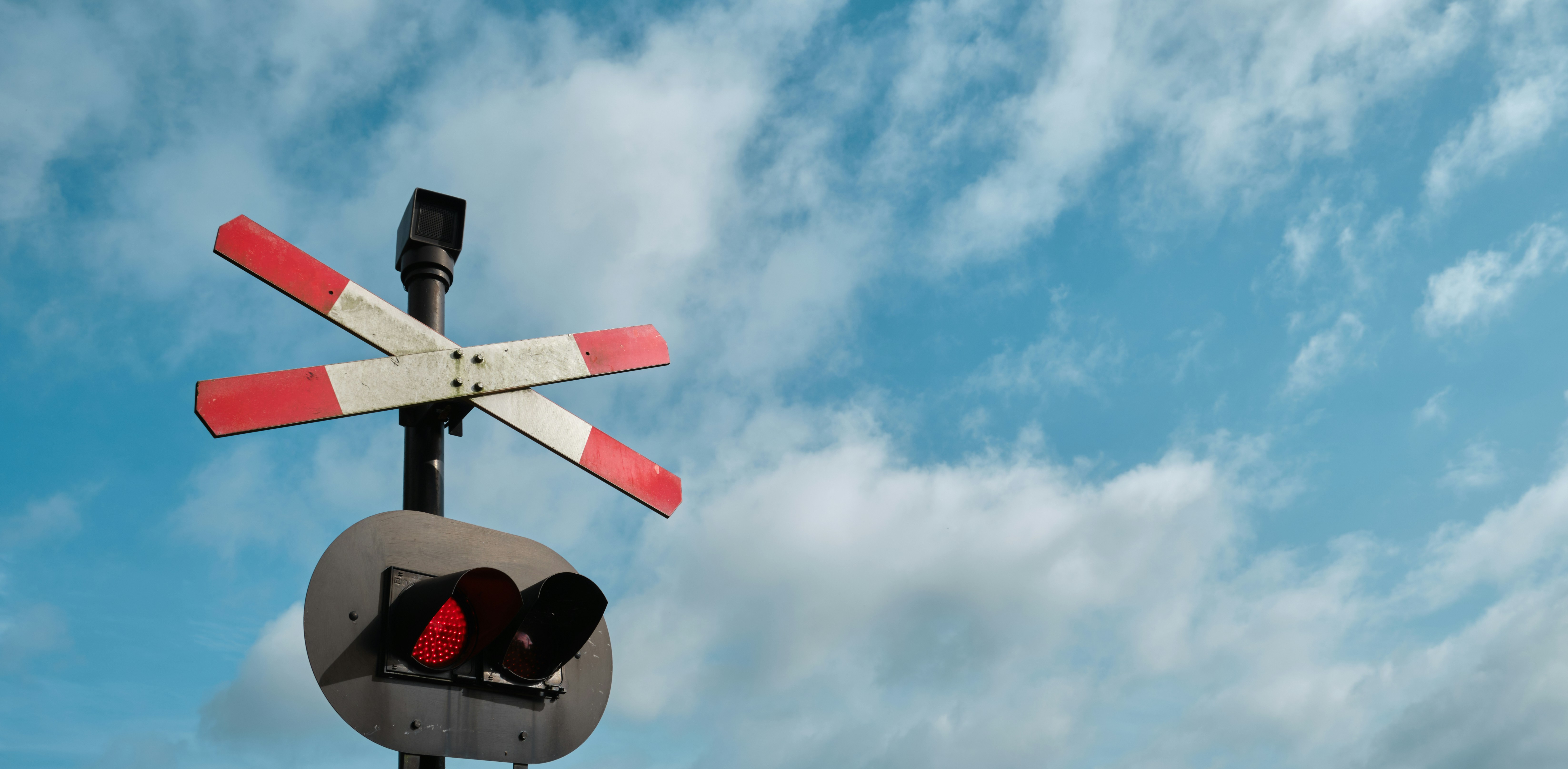 white and red traffic light under blue sky during daytime