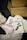 Two books by Daniel Priestley, titled 'Entrepreneur Revolution' and 'Oversubscribed', are placed on crumpled paper with an open cardboard box nearby labeled 'Wiley'.
