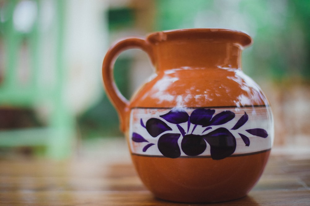 brown and green floral ceramic vase