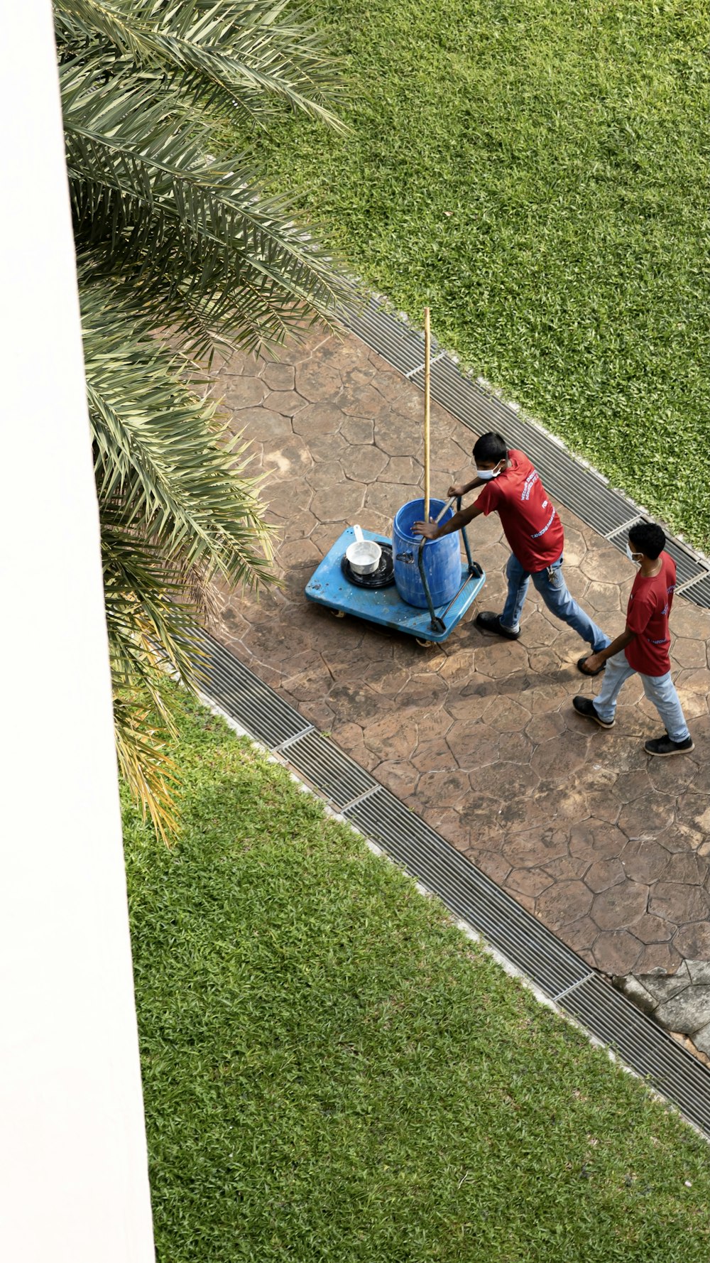 2 boys playing on blue car