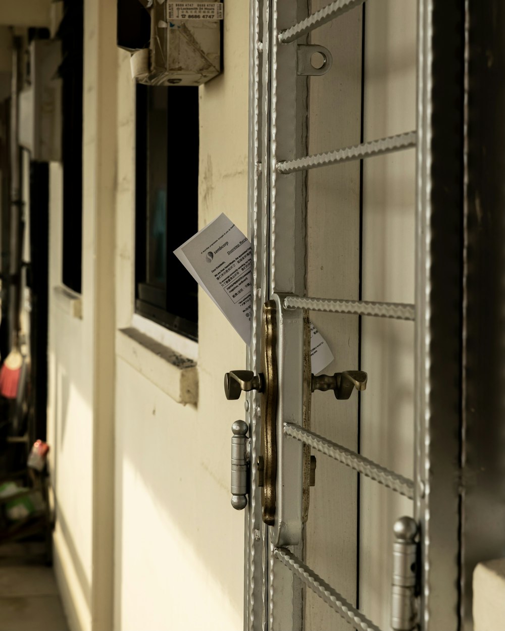 white wooden door with gray padlock