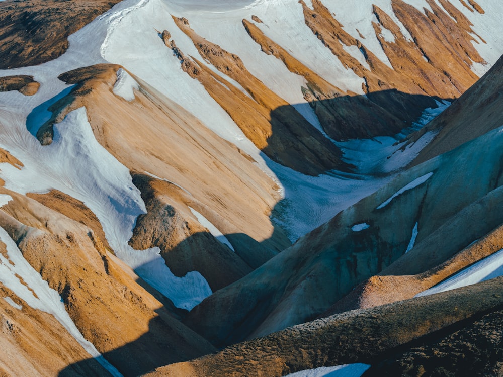 brown and white mountains during daytime