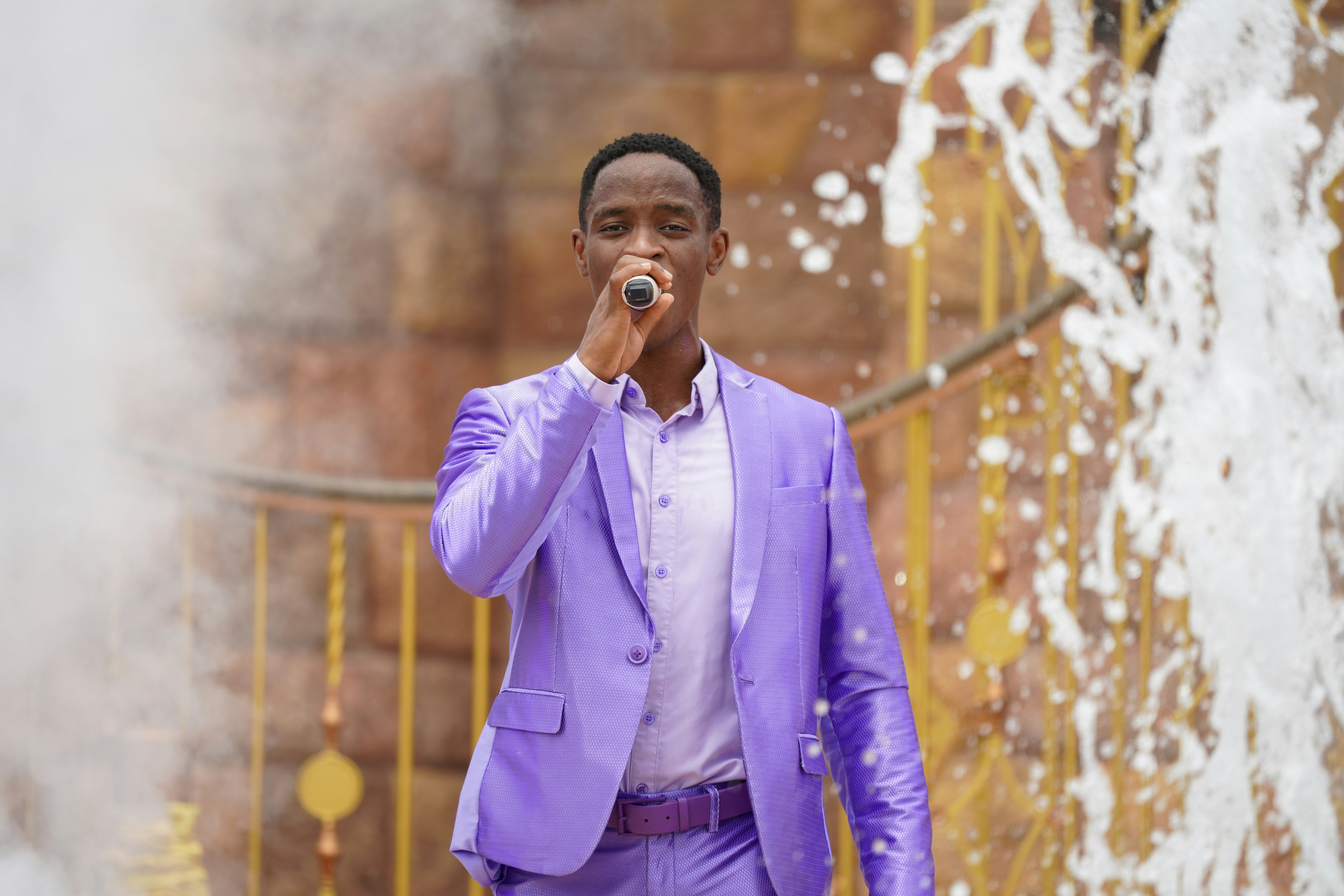 man in purple suit jacket