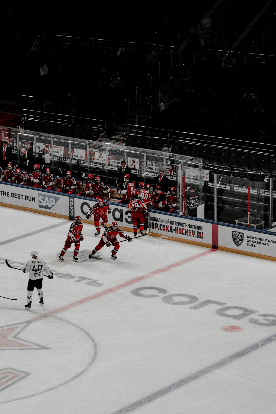 people playing ice hockey on ice stadium