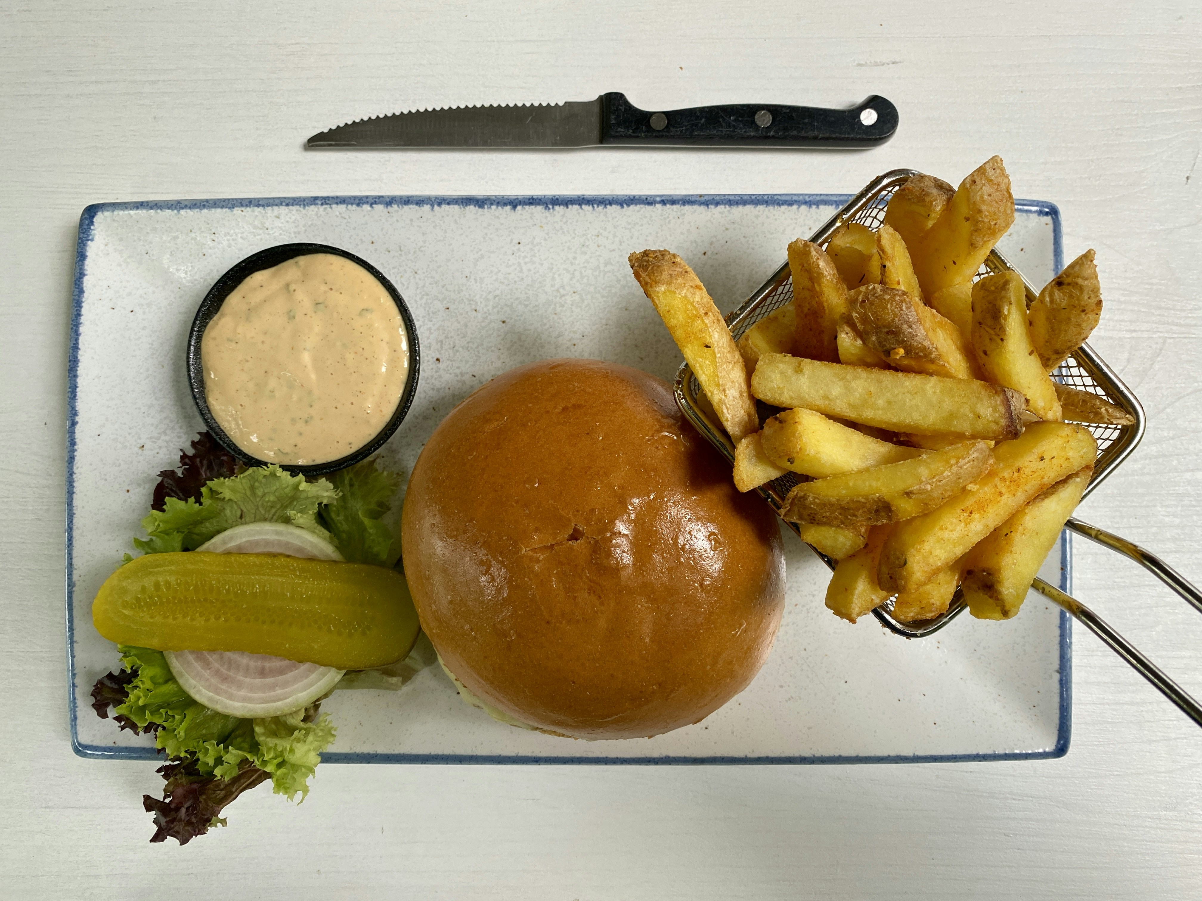 sliced apple and sliced fruit on white chopping board
