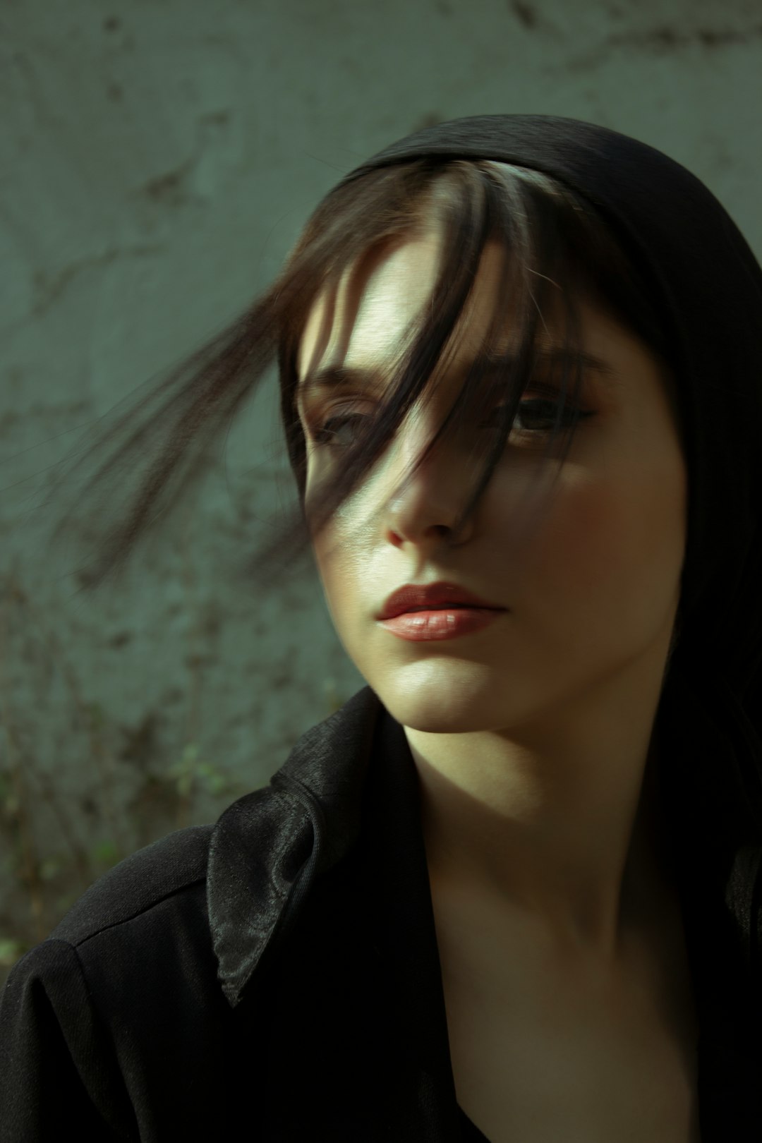 woman in black coat with black hair