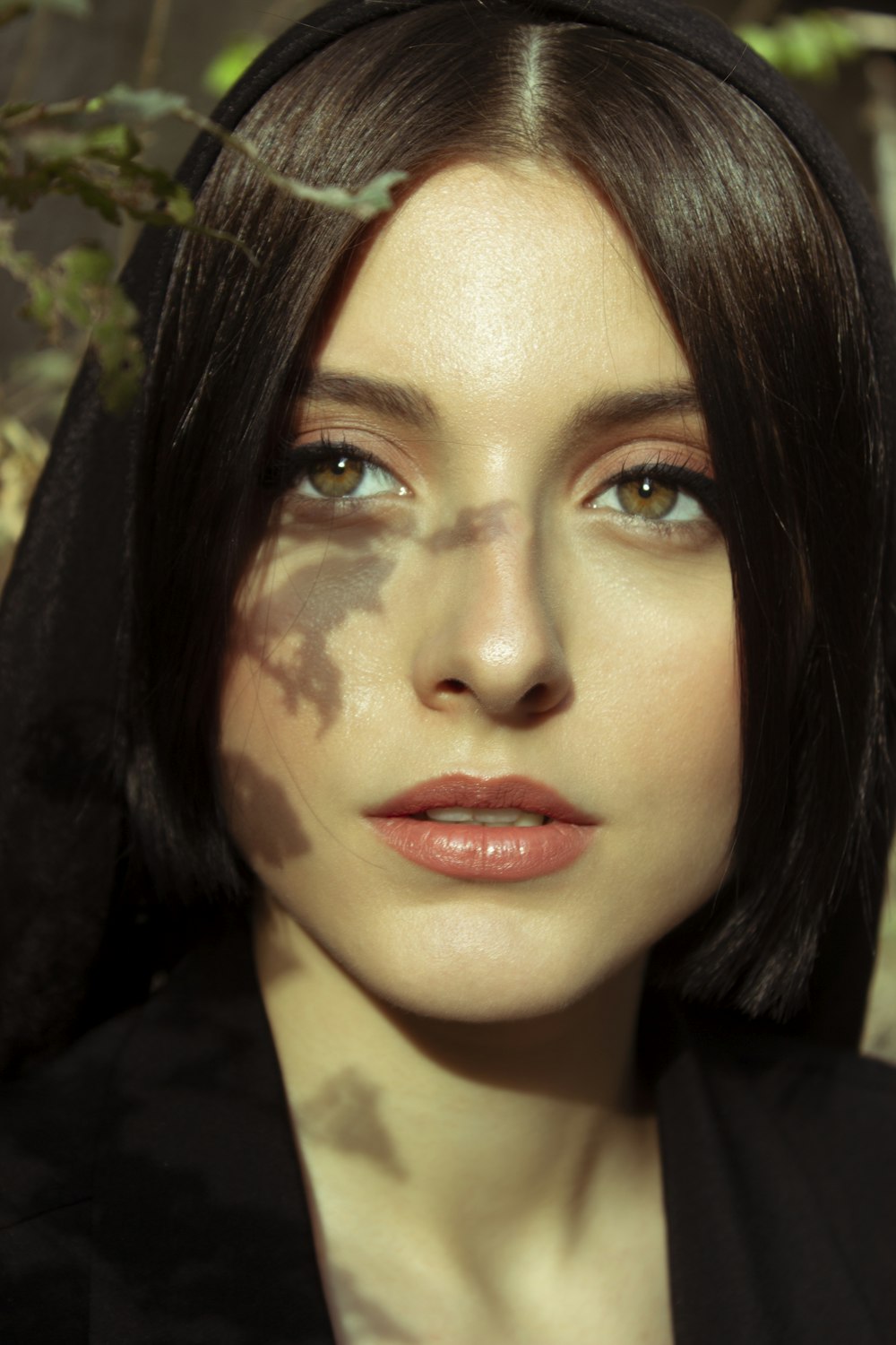 woman in black shirt with pink lipstick