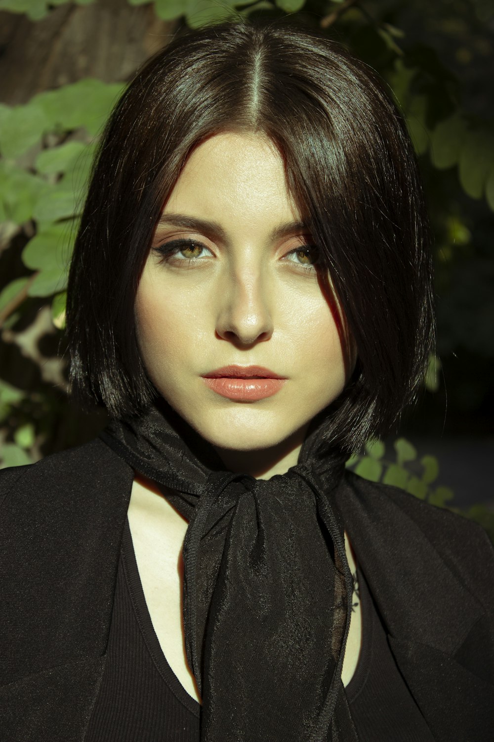 woman in black coat with brown scarf