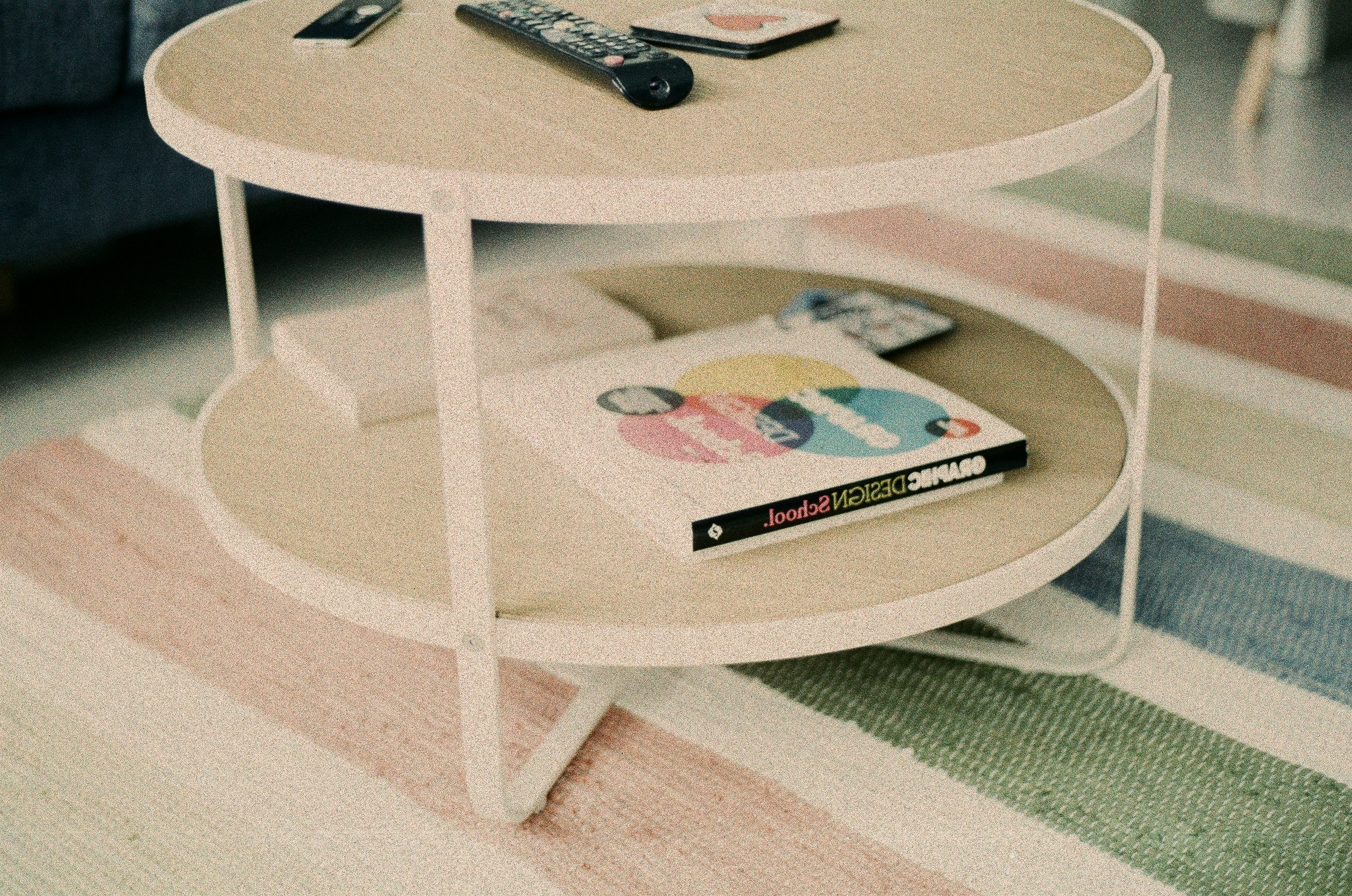 black remote control on white round table