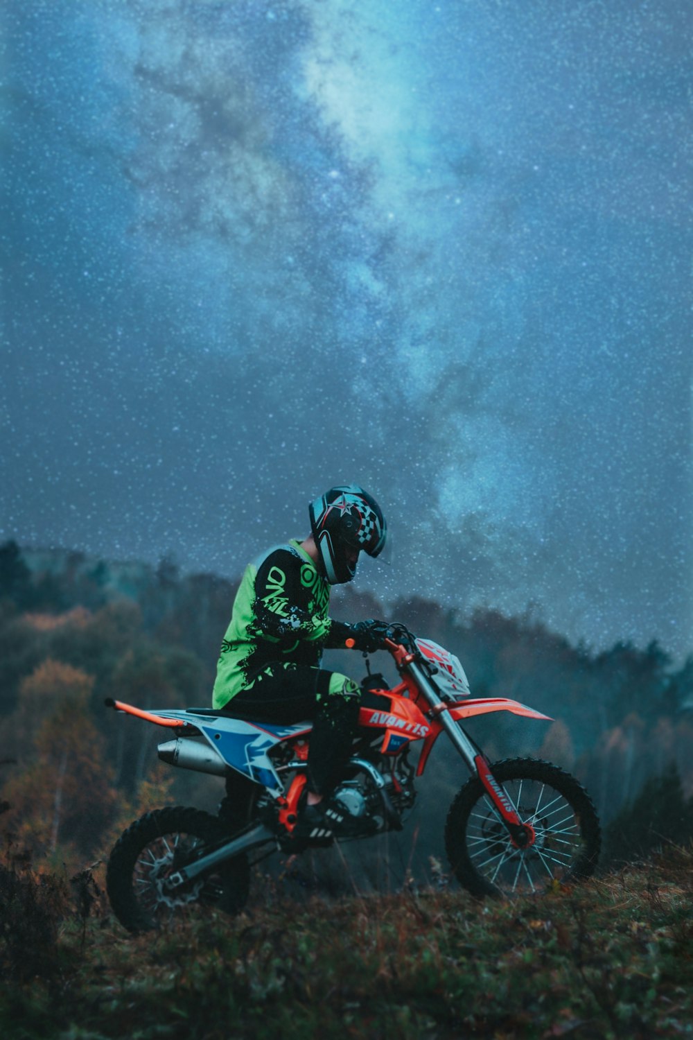 man in green jacket riding motorcycle