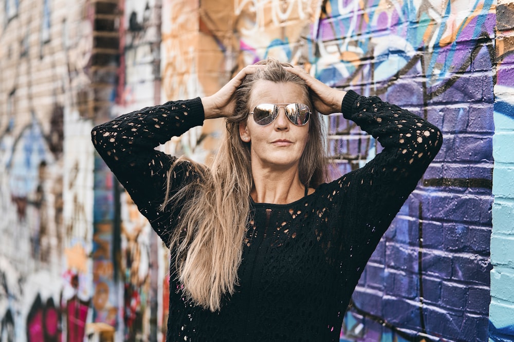 woman in black long sleeve shirt wearing sunglasses