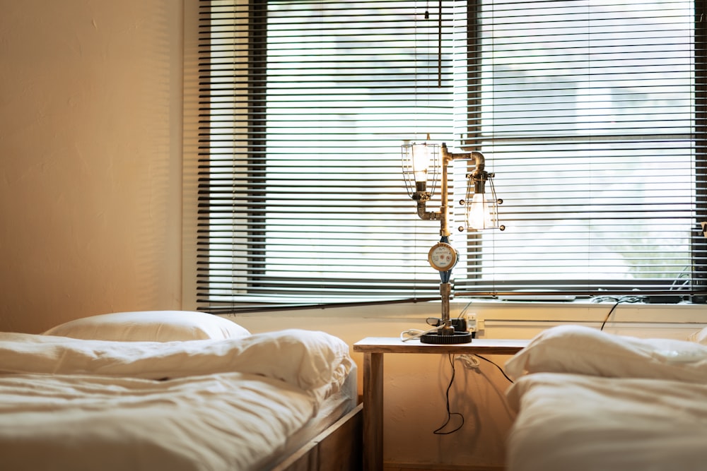 gold and white table lamp on brown wooden nightstand