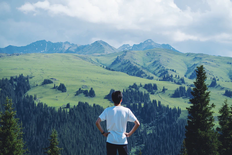 man in white T-shirt on a green field