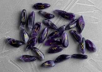 Handcrafted rune stones laid out on a natural fabric with soft lighting