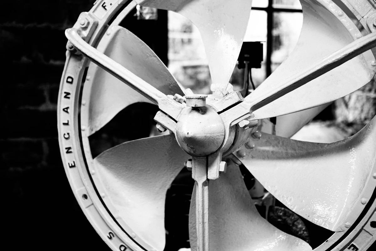 Close-up of an axial fan showing blades, casing and hub