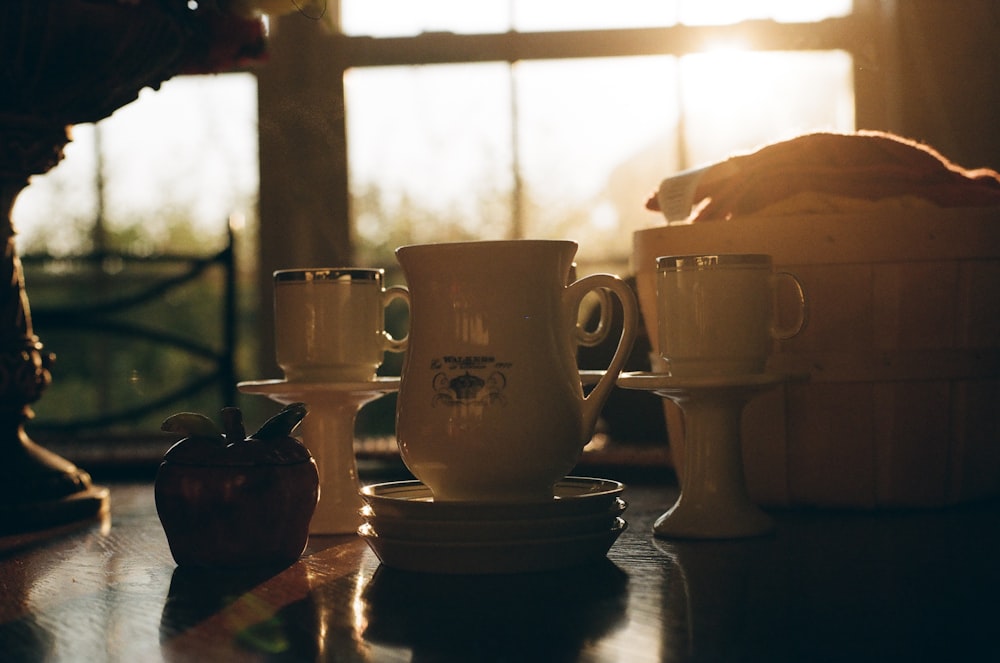 white ceramic mug on table