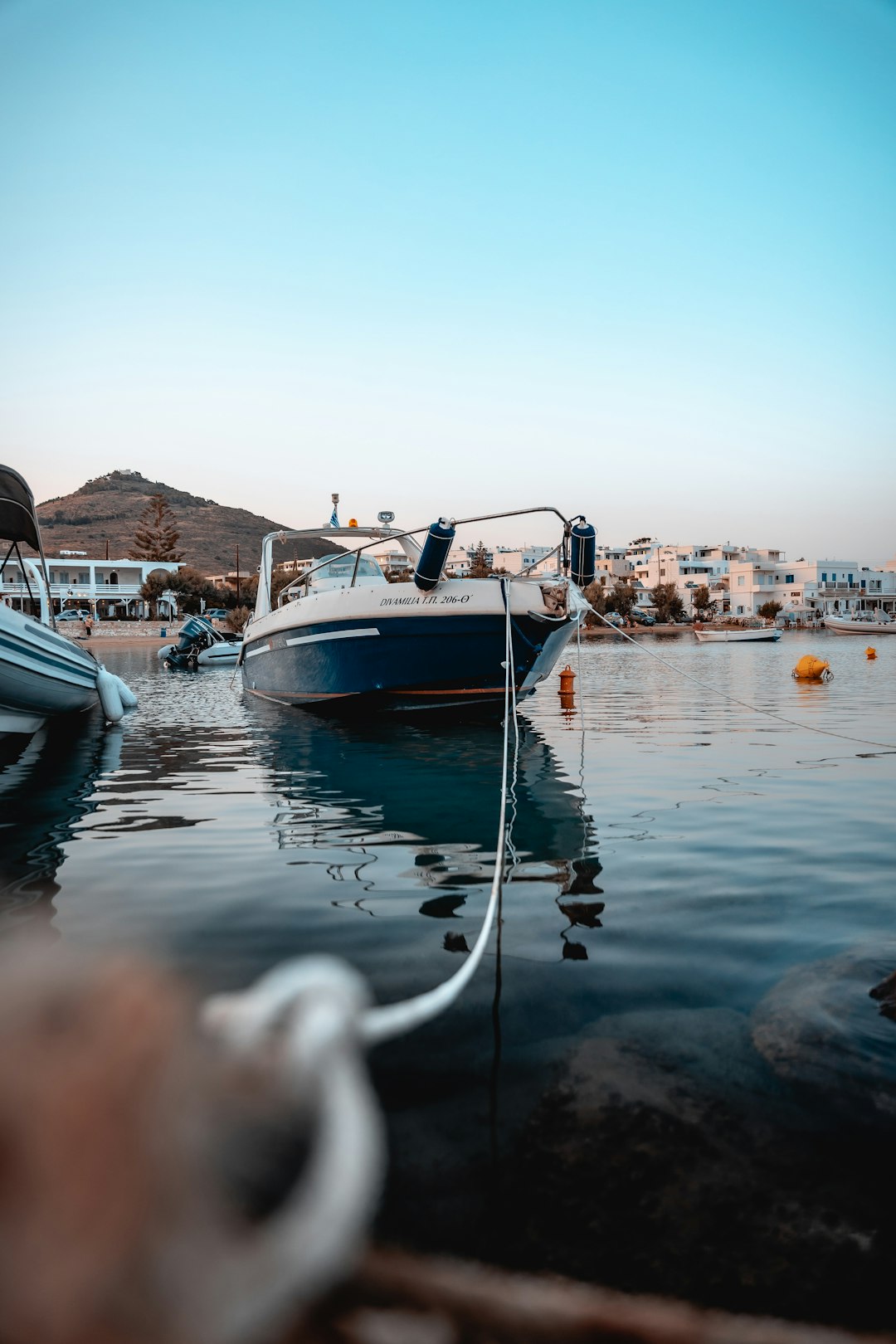 white and blue boat on water during daytime