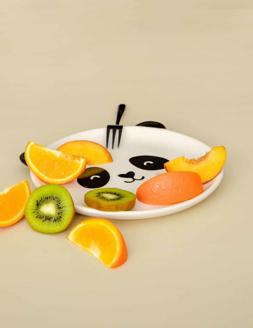 sliced orange fruit on white ceramic plate